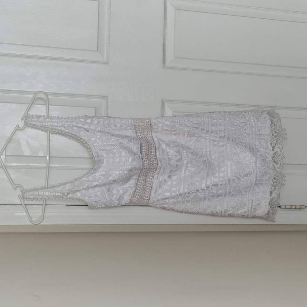 Beautiful white bebe dress. Worn once to use for en evening event.